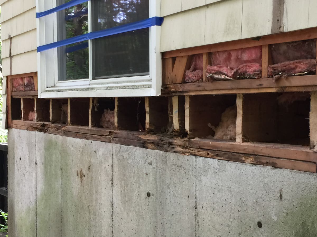 Rotted rim and sill framing, exposed under the slider