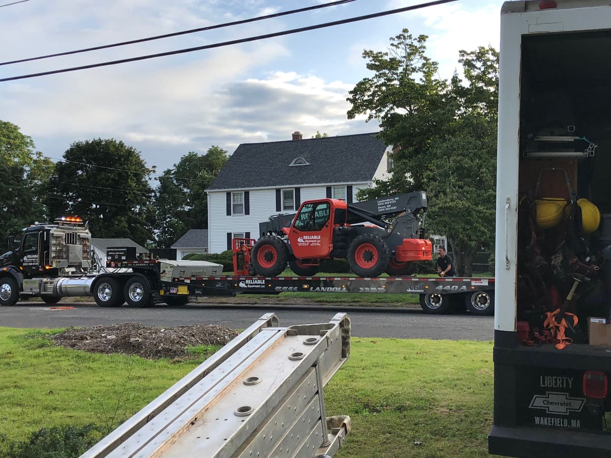 A telehandler arrives to lift materials